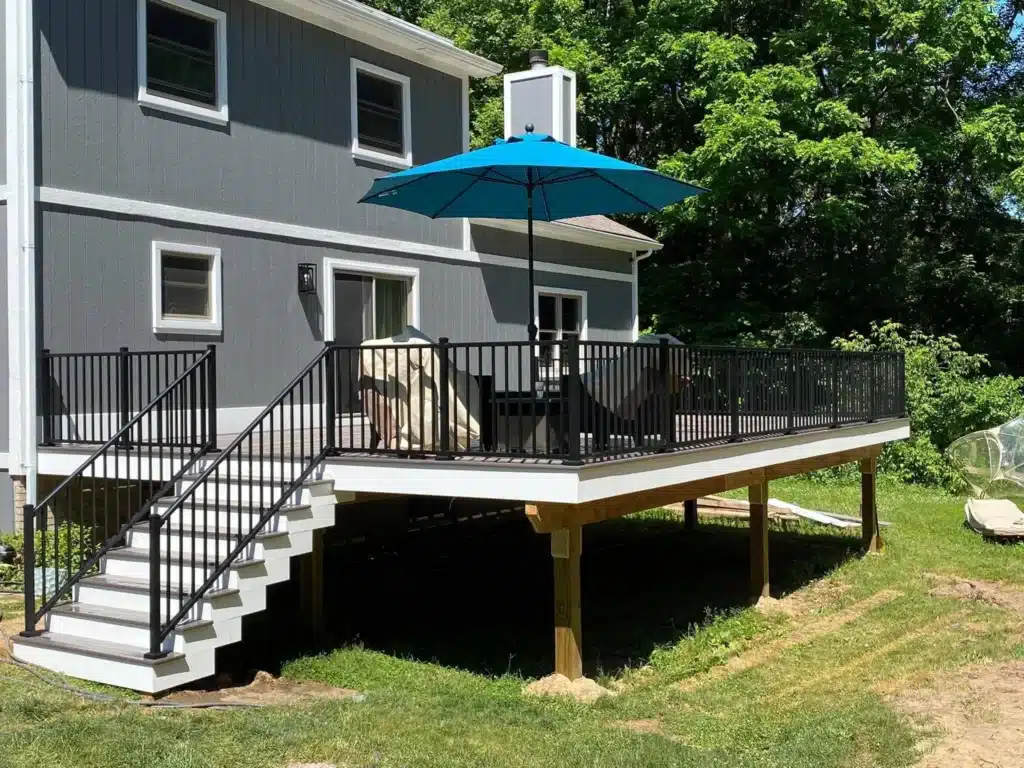 Elevated deck with Stair Construction by Spoiled Rotten Homes