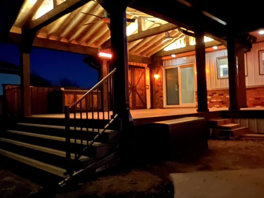 A finished and Lit Roofed Deck by Spoiled Rotten Homes