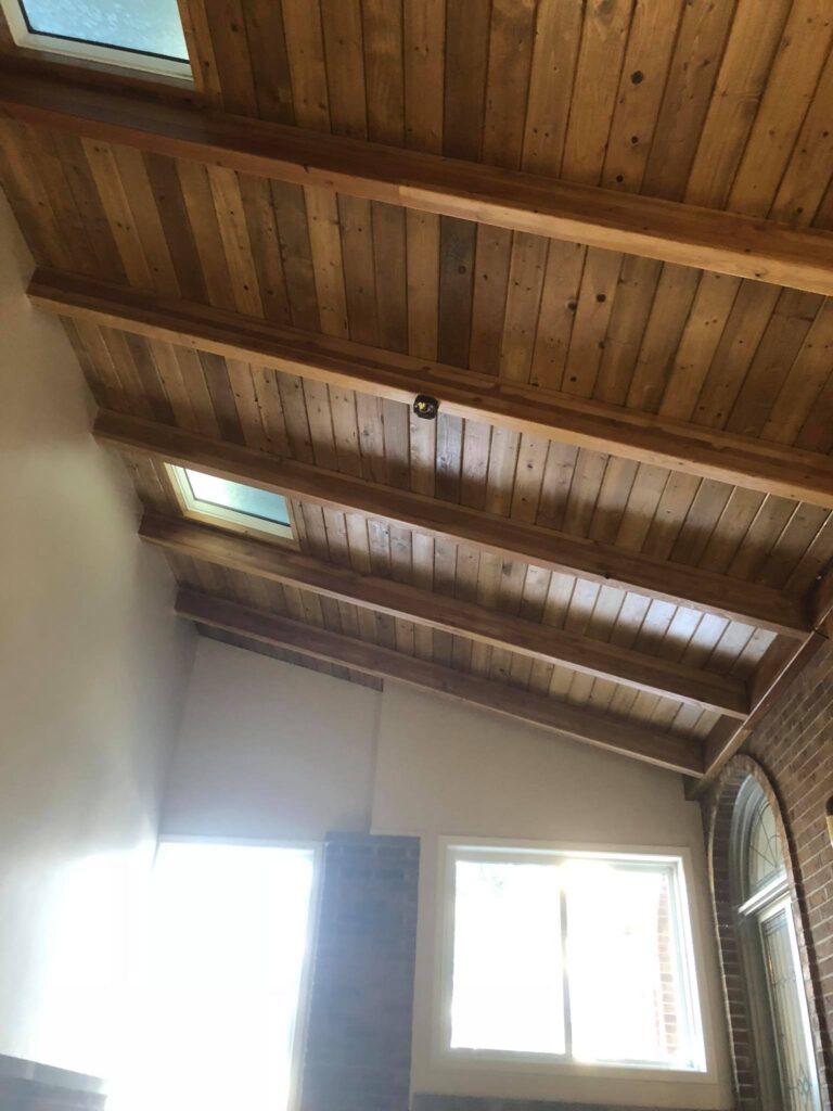 Tongue and grove ceiling above visible timber beams